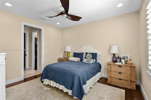 bedroom featuring dark hardwood / wood-style floors and ceiling fan