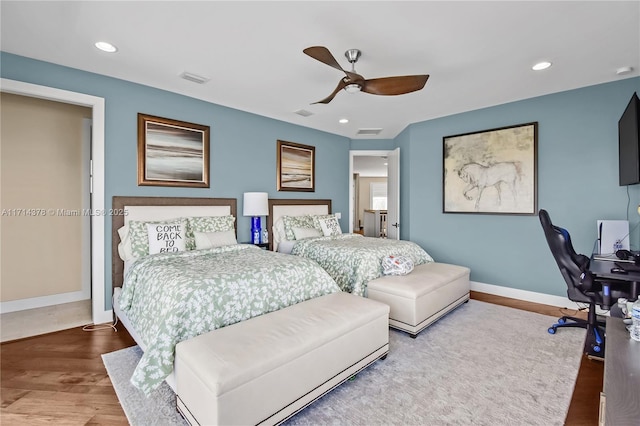 bedroom with wood-type flooring and ceiling fan