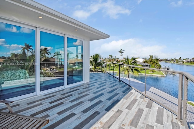 wooden deck featuring a water view