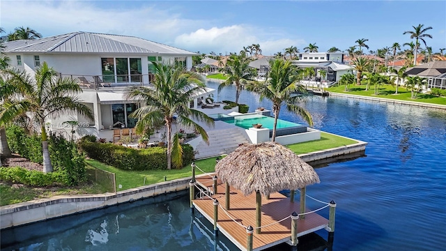 exterior space with a water view and a dock