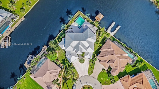 birds eye view of property featuring a water view