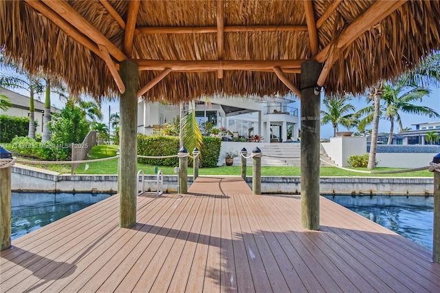 dock area with a gazebo and a water view