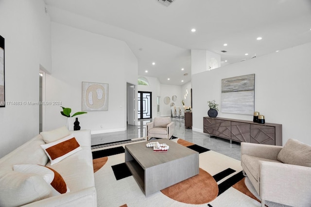 living room featuring a high ceiling