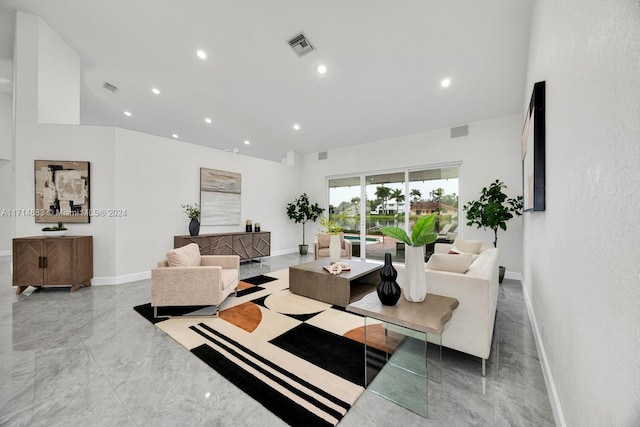 living room with a towering ceiling