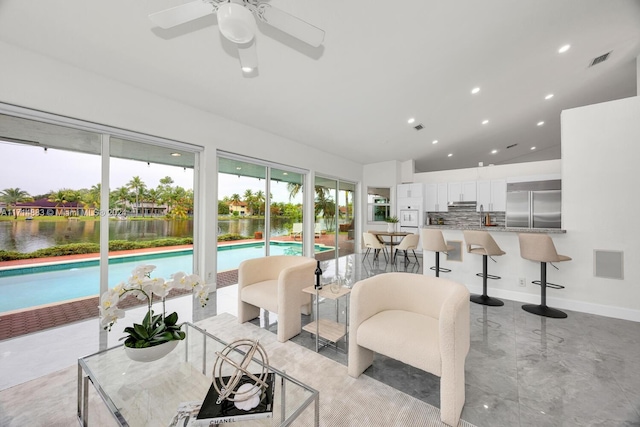 living room with ceiling fan