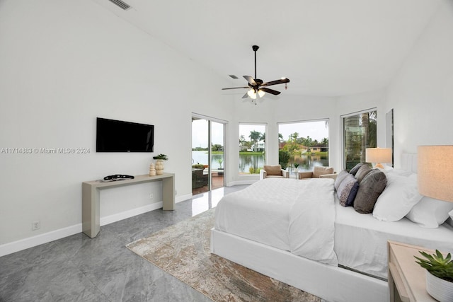 bedroom with ceiling fan and high vaulted ceiling