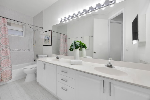 full bathroom featuring shower / bath combination with curtain, vanity, and toilet