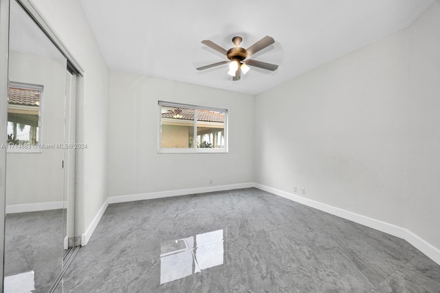 unfurnished bedroom featuring a closet and ceiling fan