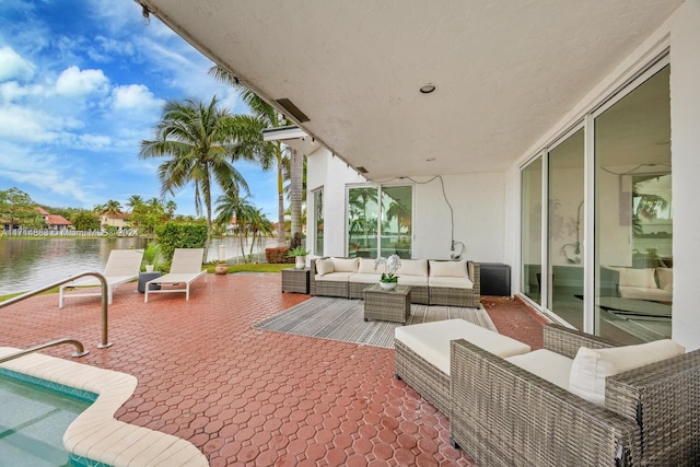 view of patio / terrace featuring a water view and an outdoor hangout area