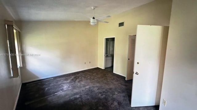 carpeted spare room featuring ceiling fan and lofted ceiling