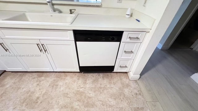 kitchen featuring white cabinetry, dishwasher, light hardwood / wood-style flooring, and sink