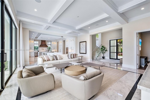 living room featuring beam ceiling, a healthy amount of sunlight, and coffered ceiling