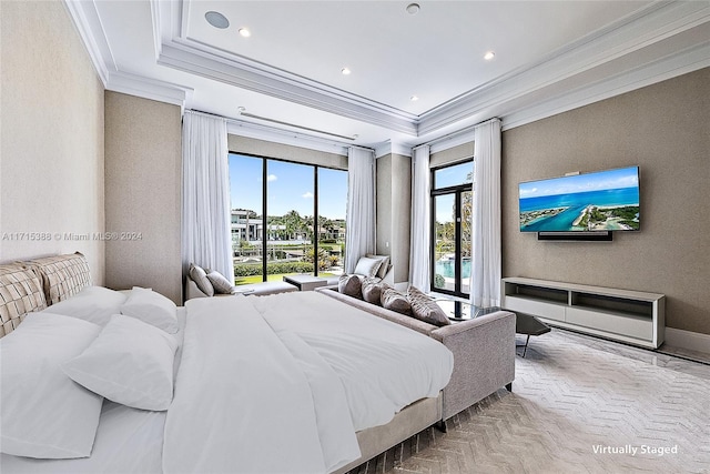 bedroom featuring a raised ceiling and crown molding