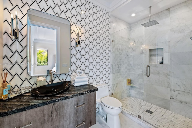 bathroom featuring vanity, toilet, walk in shower, and crown molding