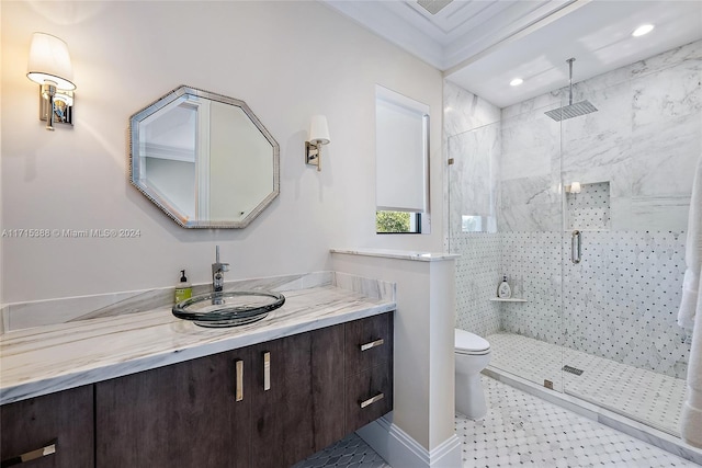 bathroom featuring tile patterned floors, vanity, crown molding, toilet, and a shower with shower door