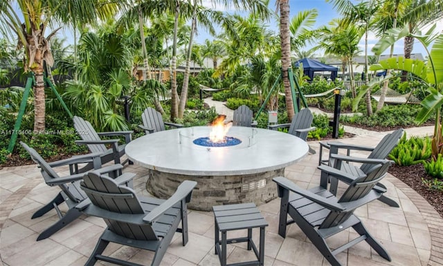 view of patio / terrace with an outdoor fire pit