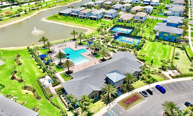 birds eye view of property featuring a water view