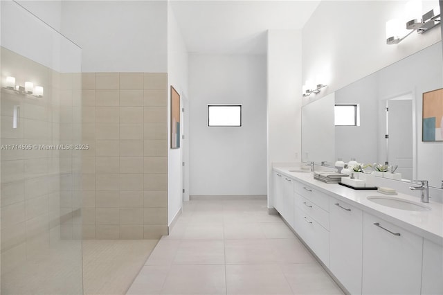 bathroom with tile patterned flooring and vanity