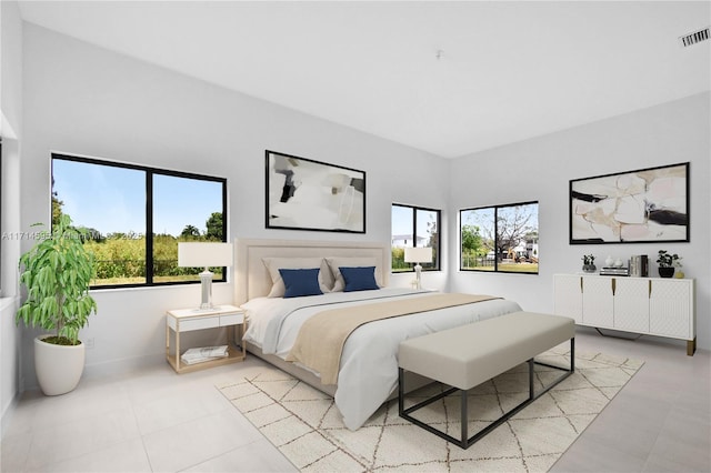 tiled bedroom with multiple windows