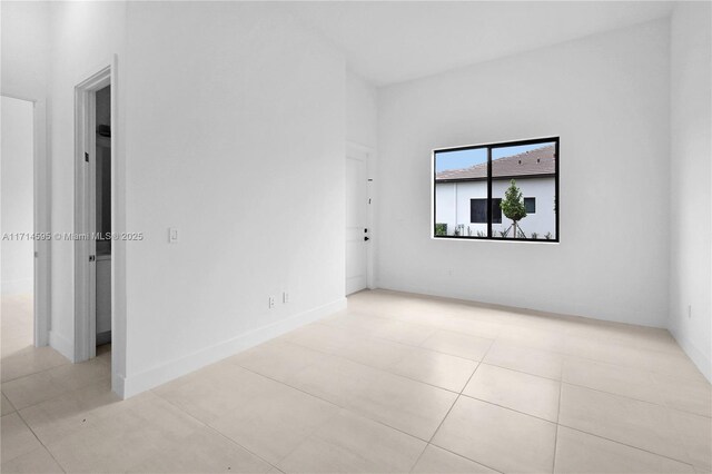 unfurnished room with light tile patterned floors