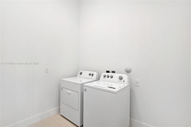 clothes washing area featuring washing machine and dryer