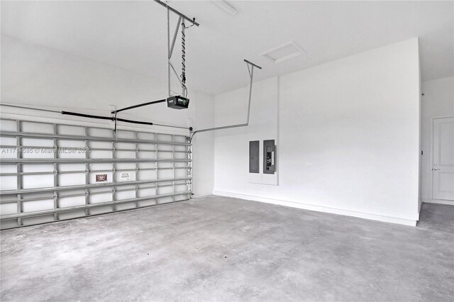 garage featuring a garage door opener and electric panel