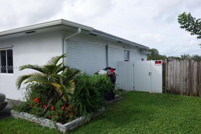 view of home's exterior featuring a lawn