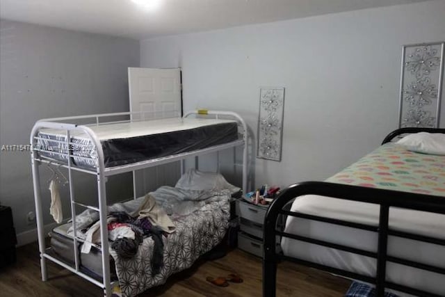 bedroom featuring dark hardwood / wood-style flooring