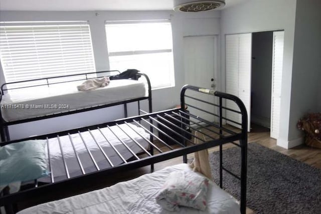 bedroom featuring hardwood / wood-style flooring and a closet