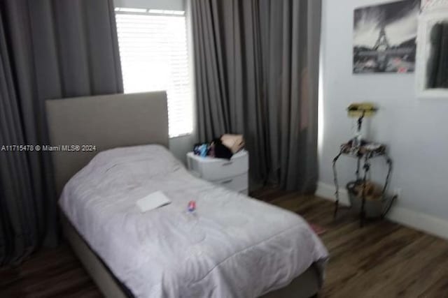 bedroom featuring dark wood-type flooring