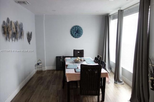 dining space featuring hardwood / wood-style floors