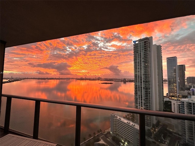 balcony at dusk with a water view