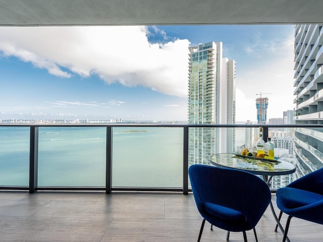 balcony featuring a water view