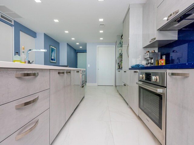 dining room featuring floor to ceiling windows and sink