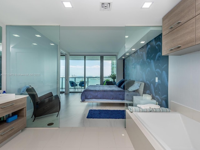 tiled bedroom with a water view and a wall of windows