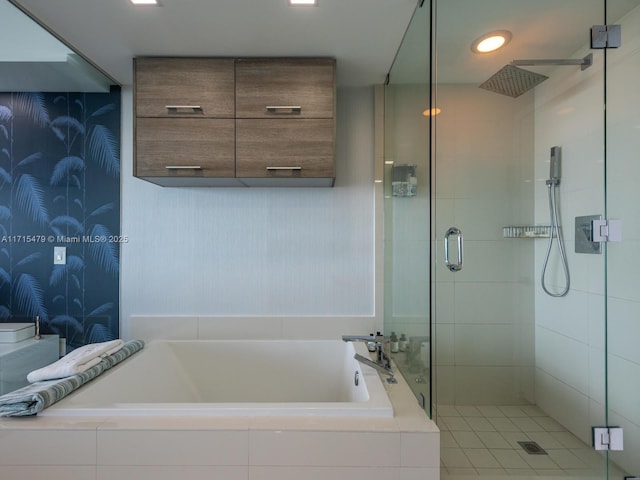 bathroom with separate shower and tub