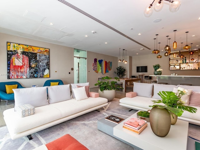 living room with an inviting chandelier