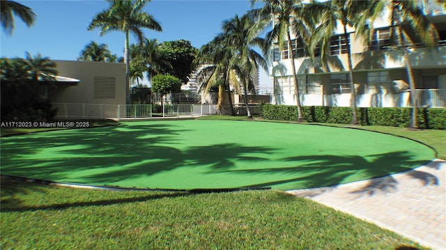 surrounding community featuring a yard and fence