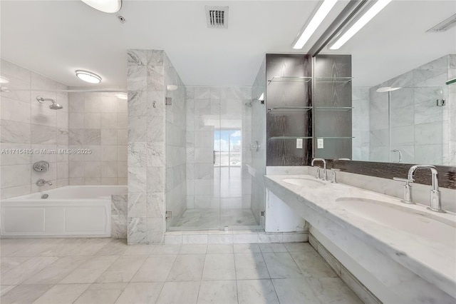 bathroom featuring a tile shower, a bathtub, a sink, and visible vents