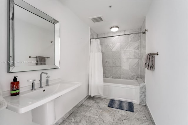 bathroom with shower / bath combination with curtain