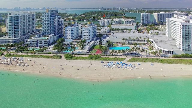 aerial view featuring a water view and a beach view