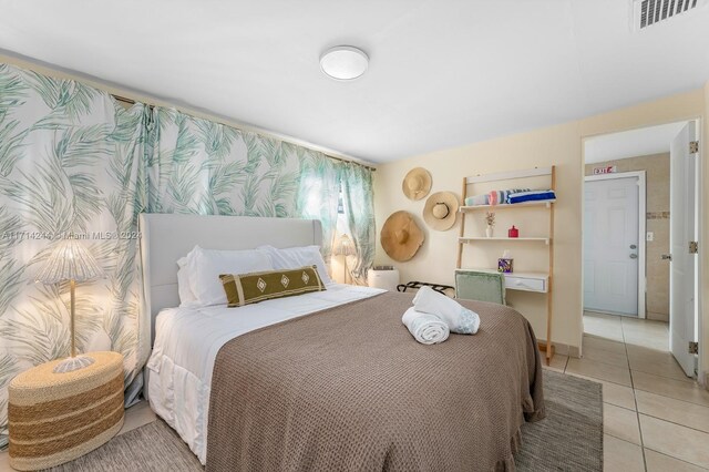 bedroom featuring light tile patterned floors