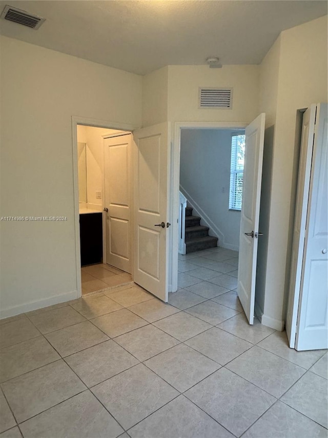 hallway with light tile patterned flooring