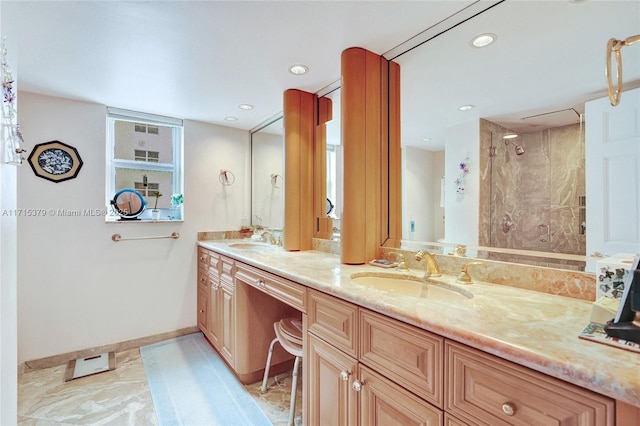 bathroom with vanity and a shower with shower door