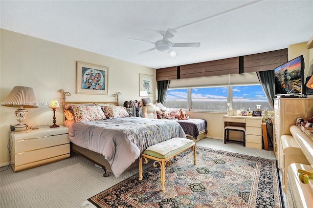 bedroom with light colored carpet and ceiling fan