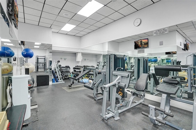 exercise room featuring a paneled ceiling