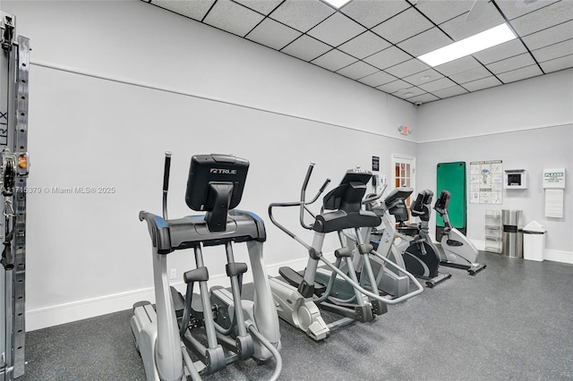 gym featuring a paneled ceiling