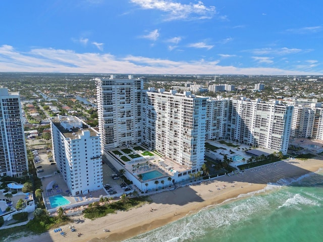 birds eye view of property featuring a water view and a view of the beach