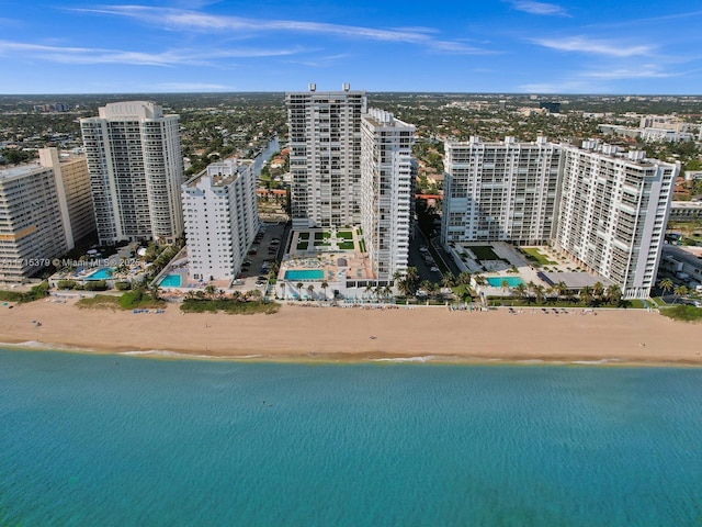 aerial view with a view of the beach and a water view