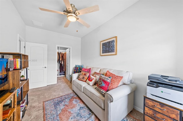 living room with ceiling fan and light carpet